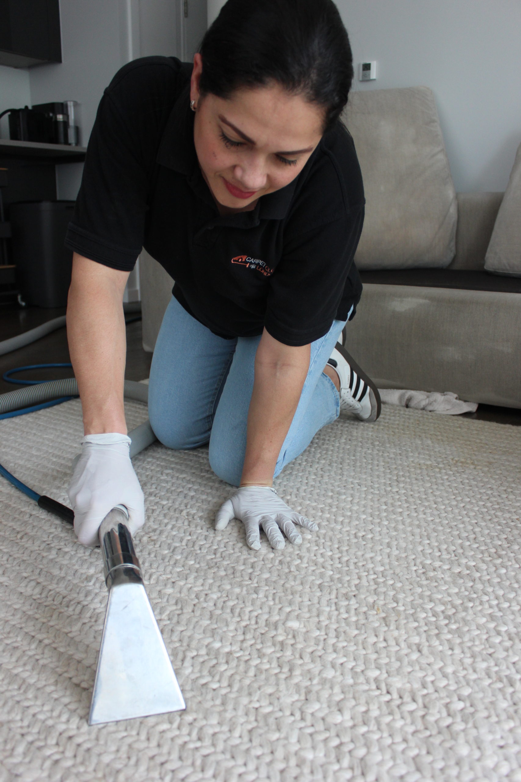Carpet cleaning technician using extraction tool in King's Cross N1