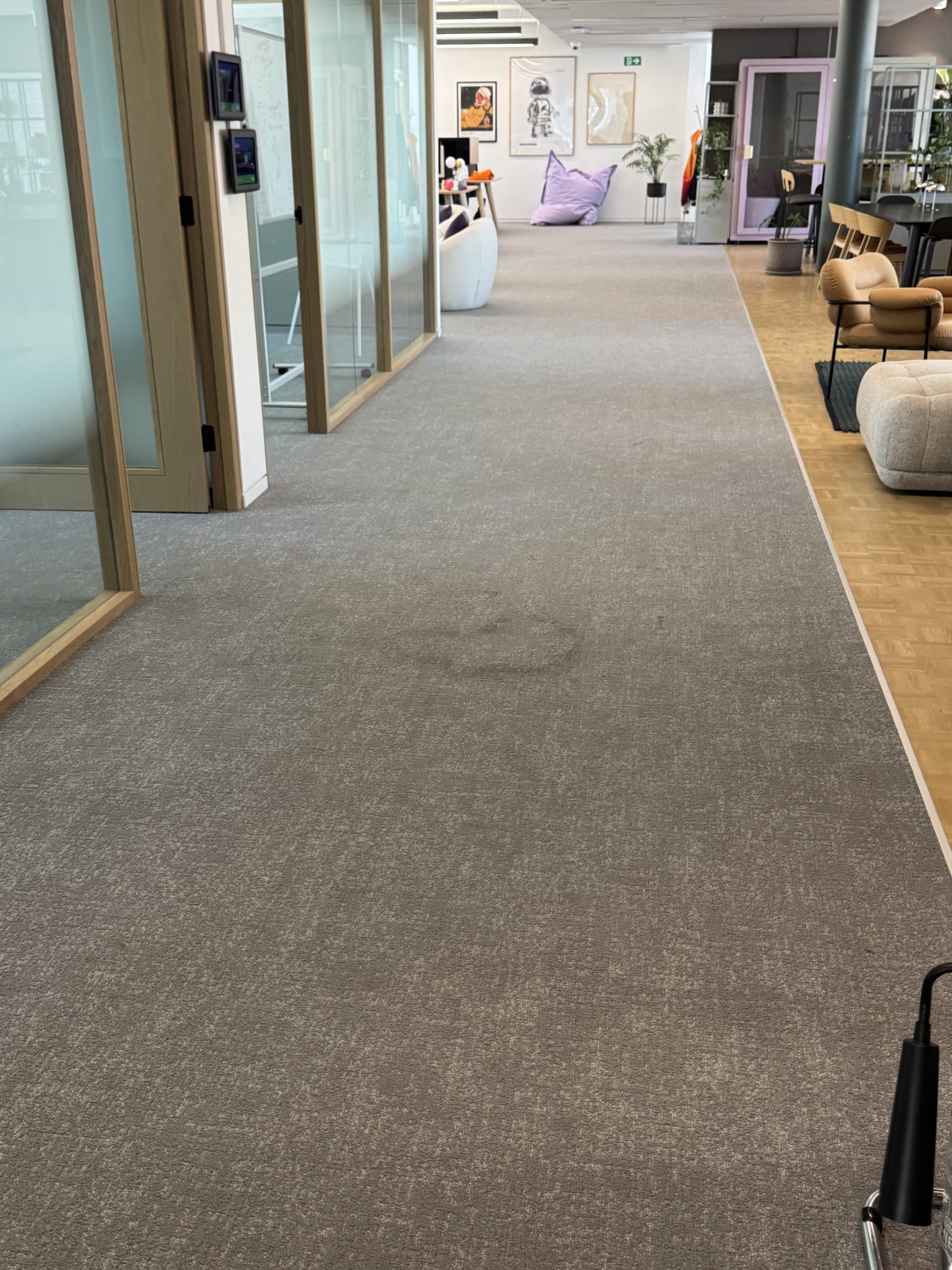 Office carpet cleaning in Central London showing high-traffic area before cleaning