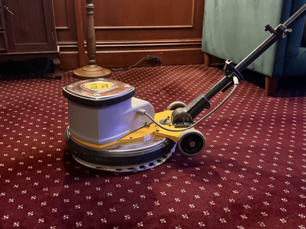 Professional carpet cleaning in Piccadilly using commercial rotary machine for deep carpet cleaning