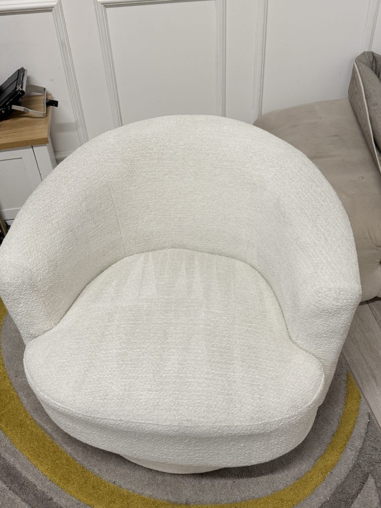 Professional upholstery cleaning of a white boucle chair in London